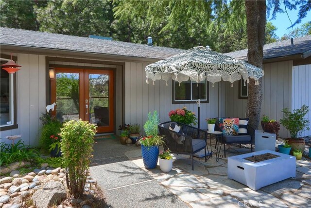 45792 Sutton Dr, Oakhurst, CA 93644 - view of patio with an outdoor fire pit and french doors