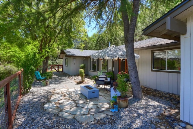 45792 Sutton Dr, Oakhurst, CA 93644 - view of patio featuring a fire pit