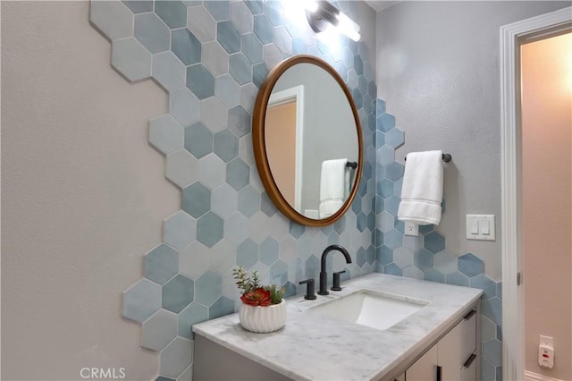45792 Sutton Dr, Oakhurst, CA 93644 - bathroom featuring tile walls, decorative backsplash, and vanity