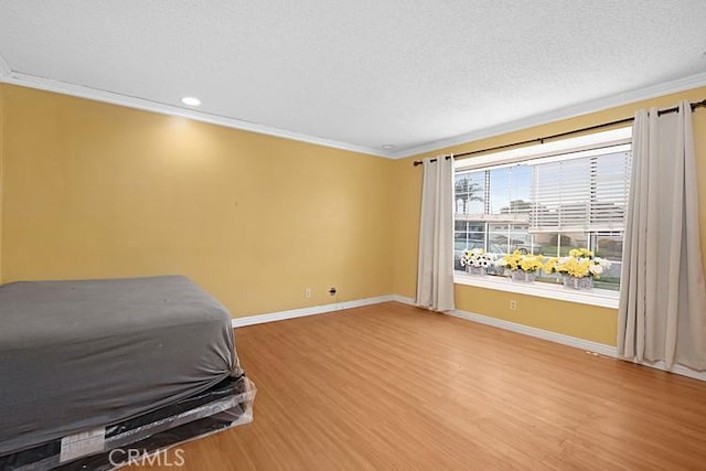 4340 Highland Ave, Oxnard, CA 93033 - bedroom featuring ornamental molding, baseboards, light wood-type flooring, a textured ceiling, and recessed lighting