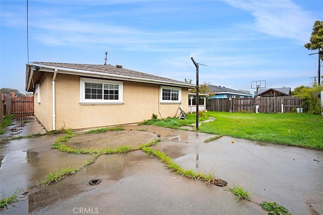4340 Highland Ave, Oxnard, CA 93033 - view of side of property featuring stucco siding and a patio
