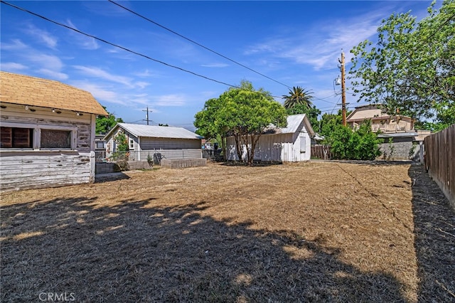 440 S Plumas St, Willows, CA 95988 - fenced backyard with an outbuilding and a storage shed
