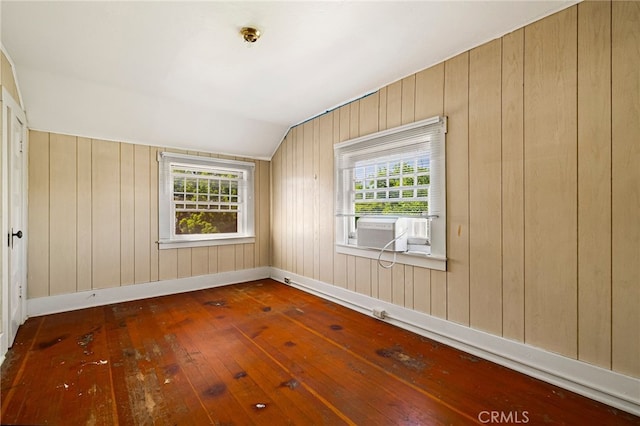 440 S Plumas St, Willows, CA 95988 - spare room featuring hardwood / wood-style flooring, cooling unit, vaulted ceiling, baseboards, and wooden walls