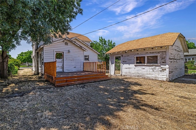 440 S Plumas St, Willows, CA 95988 - back of house featuring a deck, an outbuilding, and a shingled roof