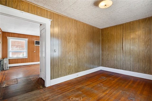 440 S Plumas St, Willows, CA 95988 - spare room featuring hardwood / wood-style flooring, baseboards, and wooden walls