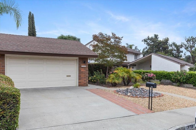 2150 Pepper Tree Pl, Escondido, CA 92026 - view of front of house featuring brick siding, concrete driveway, and a garage