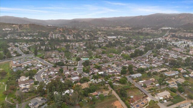 2150 Pepper Tree Pl, Escondido, CA 92026 - aerial overview of property's location featuring a mountain backdrop and nearby suburban area