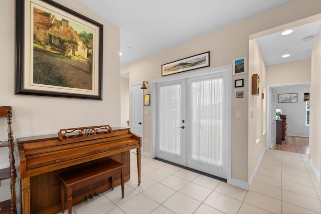 2389 Eric Rd, Fallbrook, CA 92028 - entryway with french doors, light tile patterned floors, baseboards, healthy amount of natural light, and recessed lighting