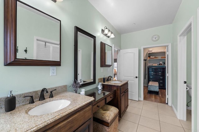 2389 Eric Rd, Fallbrook, CA 92028 - full bath featuring tile patterned flooring, two vanities, toilet, and baseboards