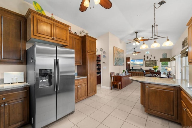 2389 Eric Rd, Fallbrook, CA 92028 - kitchen with stainless steel fridge with ice dispenser, ceiling fan, lofted ceiling, light tile patterned floors, and hanging light fixtures