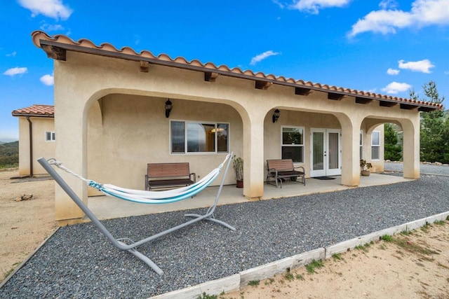 2389 Eric Rd, Fallbrook, CA 92028 - rear view of house featuring french doors, stucco siding, and a patio area