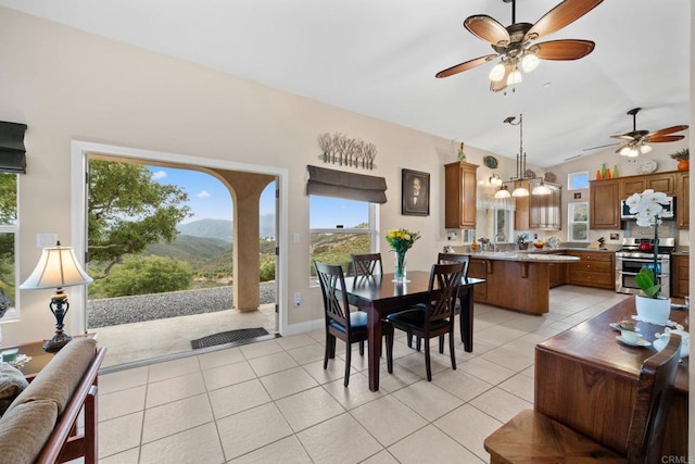 2389 Eric Rd, Fallbrook, CA 92028 - dining area featuring ceiling fan, lofted ceiling, light tile patterned flooring, and a mountain view
