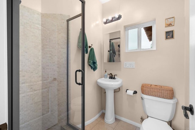 2389 Eric Rd, Fallbrook, CA 92028 - bathroom with toilet, a shower stall, tile patterned flooring, and baseboards
