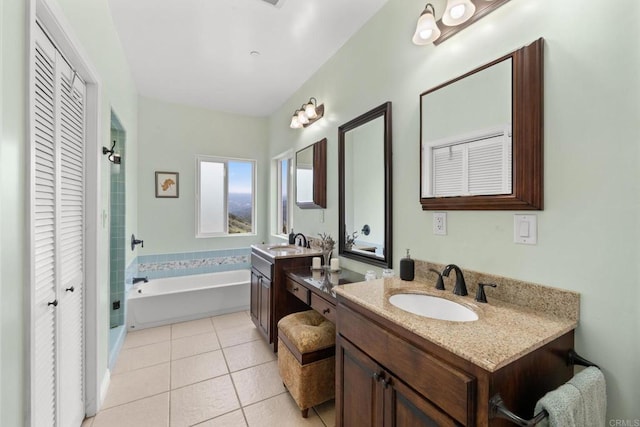 2389 Eric Rd, Fallbrook, CA 92028 - bathroom featuring a closet, a bath, tile patterned flooring, and two vanities