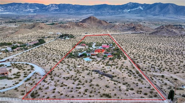 31024 Rabbit Springs Rd, Lucerne Valley, CA 92356 - view of rural area featuring a mountain backdrop, property parcel outlined, and a desert landscape