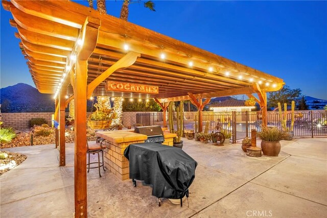 31024 Rabbit Springs Rd, Lucerne Valley, CA 92356 - view of patio featuring a fenced backyard, grilling area, and a mountain view