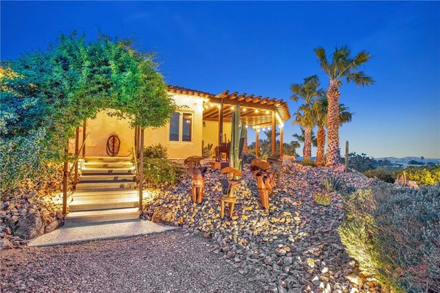 31024 Rabbit Springs Rd, Lucerne Valley, CA 92356 - view of front of home with a pergola and stucco siding