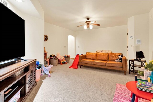 31024 Rabbit Springs Rd, Lucerne Valley, CA 92356 - living room with arched walkways, carpet flooring, and a ceiling fan