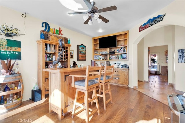 31024 Rabbit Springs Rd, Lucerne Valley, CA 92356 - indoor dry bar with a ceiling fan, arched walkways, light wood-type flooring, and built in features