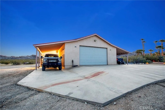 31024 Rabbit Springs Rd, Lucerne Valley, CA 92356 - garage featuring driveway and a mountain view