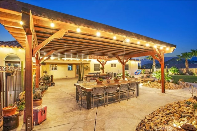 31024 Rabbit Springs Rd, Lucerne Valley, CA 92356 - view of patio / terrace featuring fence, outdoor dining area, and a mountain view