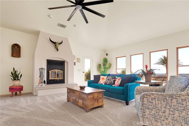 31024 Rabbit Springs Rd, Lucerne Valley, CA 92356 - living room featuring carpet, ceiling fan, a fireplace, and vaulted ceiling