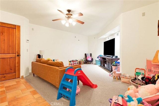 31024 Rabbit Springs Rd, Lucerne Valley, CA 92356 - playroom featuring ceiling fan and light stone finish floors