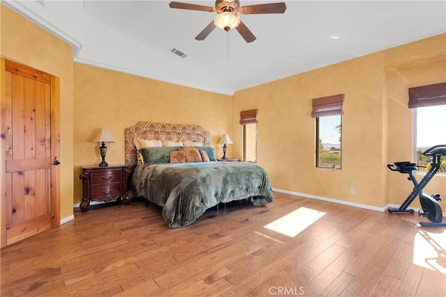 31024 Rabbit Springs Rd, Lucerne Valley, CA 92356 - bedroom with hardwood / wood-style flooring, vaulted ceiling, baseboards, and a ceiling fan
