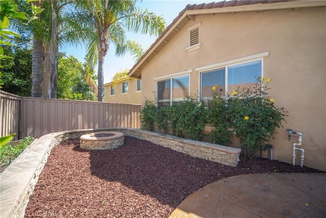 43922 Carentan Dr, Temecula, CA 92592 - fenced backyard with an outdoor fire pit and a patio