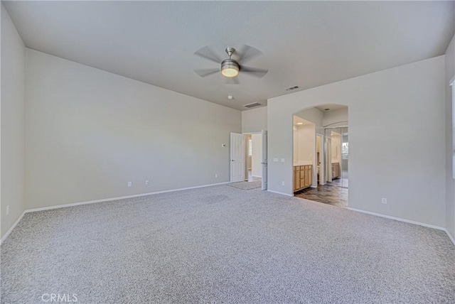43922 Carentan Dr, Temecula, CA 92592 - unfurnished bedroom with arched walkways, carpet, ensuite bath, and a ceiling fan