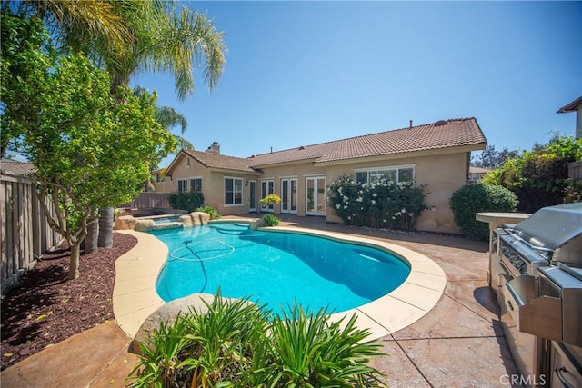 43922 Carentan Dr, Temecula, CA 92592 - view of pool with a fenced backyard, a pool with connected hot tub, a patio, and area for grilling