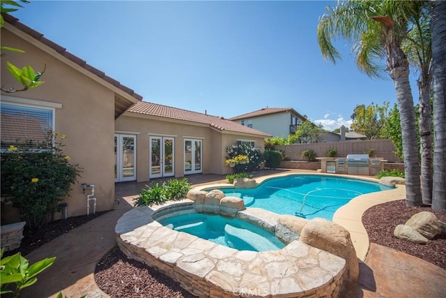 43922 Carentan Dr, Temecula, CA 92592 - view of swimming pool with a fenced backyard, french doors, a pool with connected hot tub, and a patio