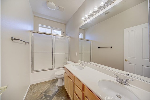 43922 Carentan Dr, Temecula, CA 92592 - bathroom with bath / shower combo with glass door, double vanity, and stone finish flooring