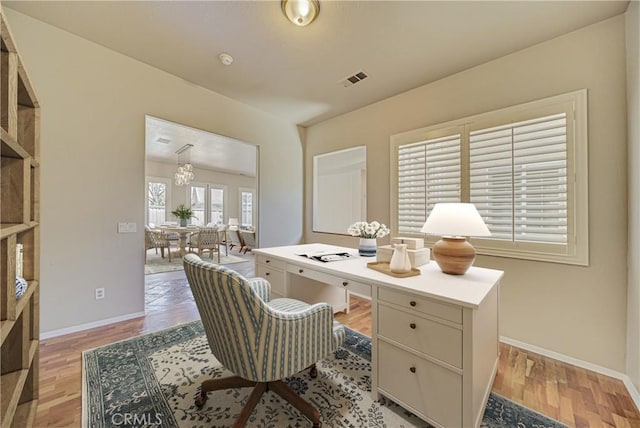 43922 Carentan Dr, Temecula, CA 92592 - office space with light wood-style floors and a chandelier