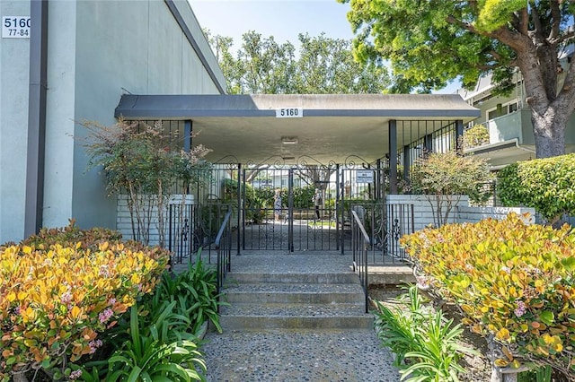 doorway to property featuring stucco siding