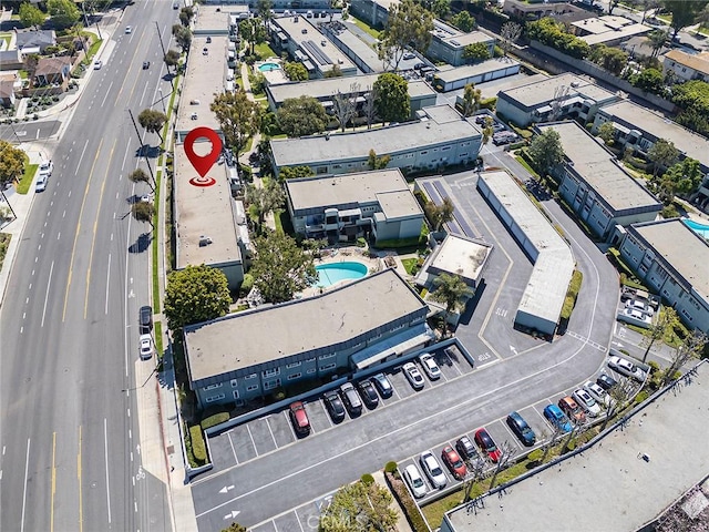 aerial view of property and surrounding area with a pool