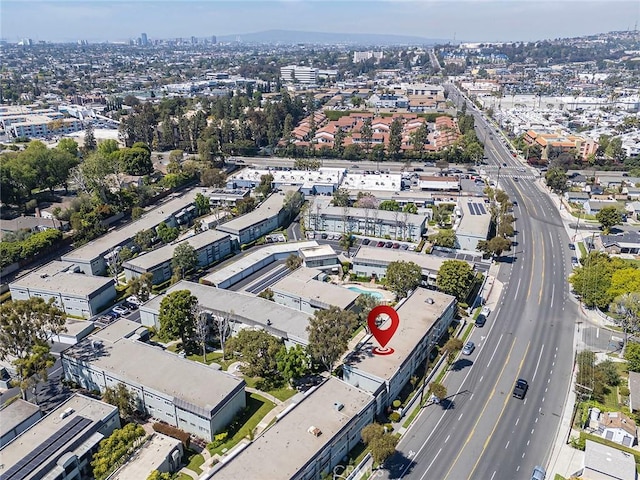 aerial overview of property's location featuring nearby urban area and a highway