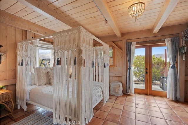 51609 Oregon Trl, Morongo Valley, CA 92256 - bedroom with access to exterior, french doors, beam ceiling, wood walls, and wooden ceiling
