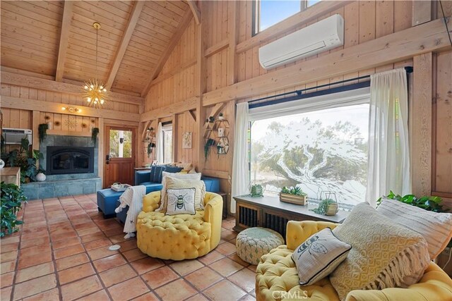 51609 Oregon Trl, Morongo Valley, CA 92256 - tiled living room featuring an AC wall unit, beam ceiling, wood ceiling, high vaulted ceiling, and healthy amount of natural light