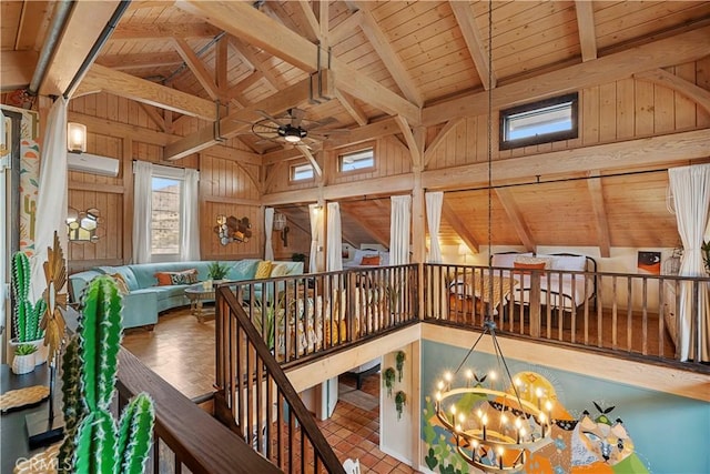 51609 Oregon Trl, Morongo Valley, CA 92256 - hallway featuring wood ceiling, a chandelier, wooden walls, and an upstairs landing