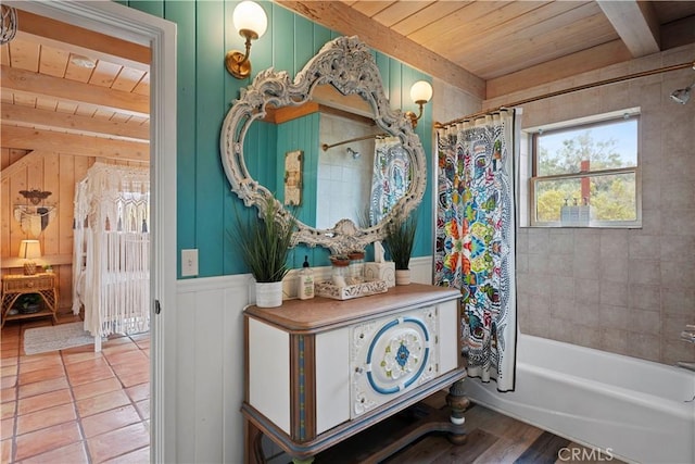 51609 Oregon Trl, Morongo Valley, CA 92256 - full bath with wooden ceiling, beam ceiling, shower / bath combo with shower curtain, a decorative wall, and wood finished floors