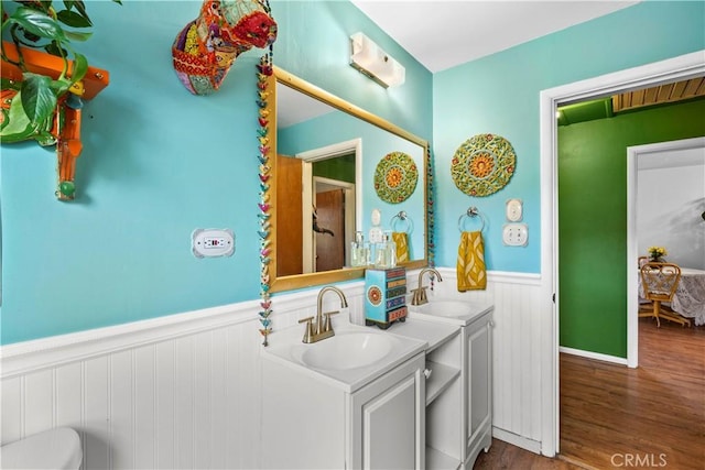 51609 Oregon Trl, Morongo Valley, CA 92256 - bathroom featuring a wainscoted wall, vanity, and wood finished floors