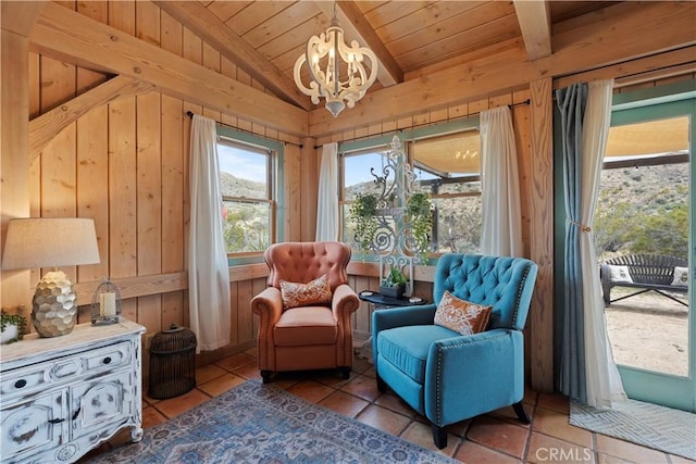 51609 Oregon Trl, Morongo Valley, CA 92256 - living area with a chandelier, wood walls, wooden ceiling, and tile patterned floors
