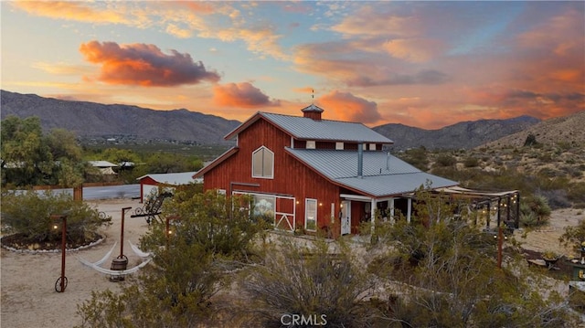51609 Oregon Trl, Morongo Valley, CA 92256 - rear view of property featuring a mountain view, metal roof, and a garage