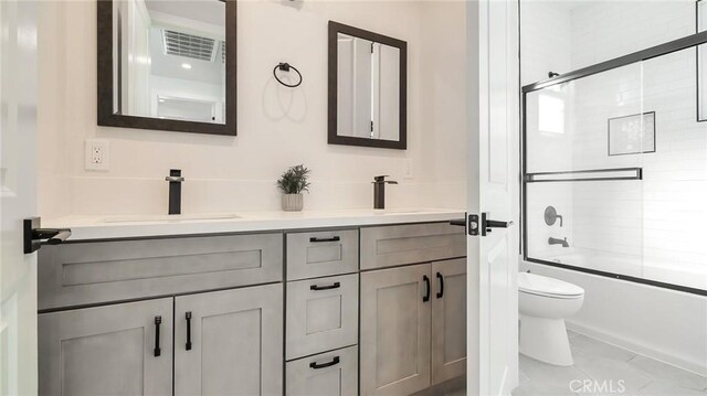 2030 Brentwood Pl, Claremont, CA 91711 - bathroom with toilet, double vanity, and enclosed tub / shower combo