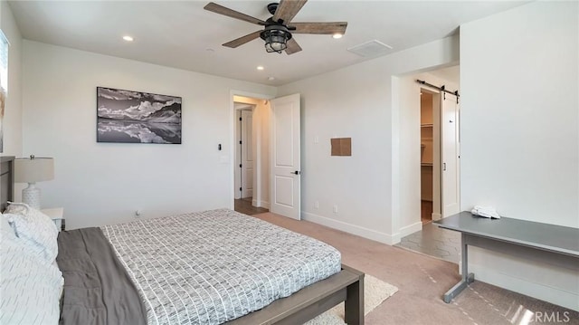 2030 Brentwood Pl, Claremont, CA 91711 - bedroom with a barn door, light colored carpet, recessed lighting, a ceiling fan, and a spacious closet