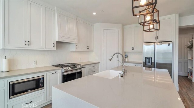 2030 Brentwood Pl, Claremont, CA 91711 - kitchen with stainless steel appliances, a sink, light countertops, white cabinetry, and recessed lighting