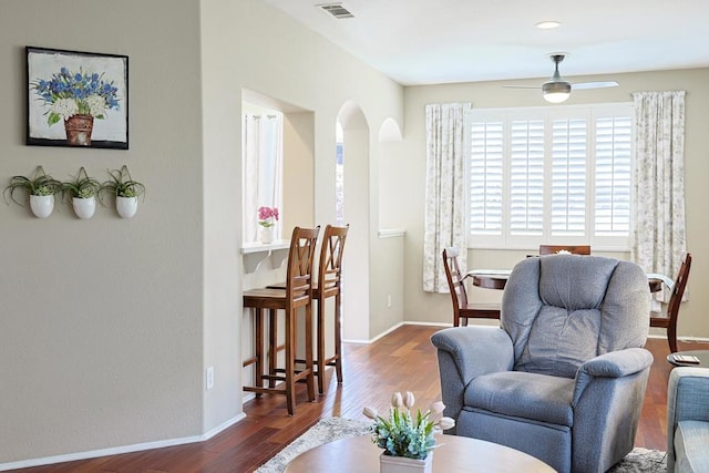 1825 Via Capri St, Chula Vista, CA 91913 - living room featuring arched walkways, wood finished floors, ceiling fan, and baseboards