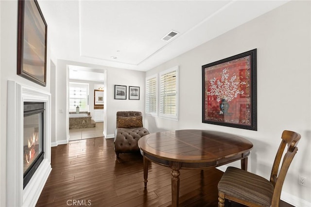 4448 St Cloud, Claremont, CA 91711 - living area featuring a glass covered fireplace, dark wood-style flooring, and baseboards
