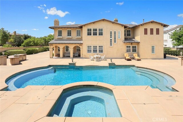 4448 St Cloud, Claremont, CA 91711 - swimming pool with an in-ground hot tub and a patio area